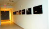 Photographs displayed in a hallway.