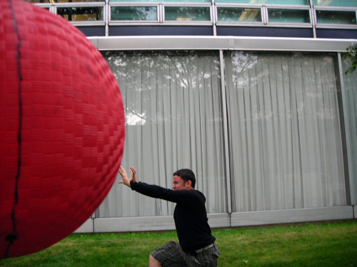 A trick photo makes it appear as if a student will be run over by a giant ball.