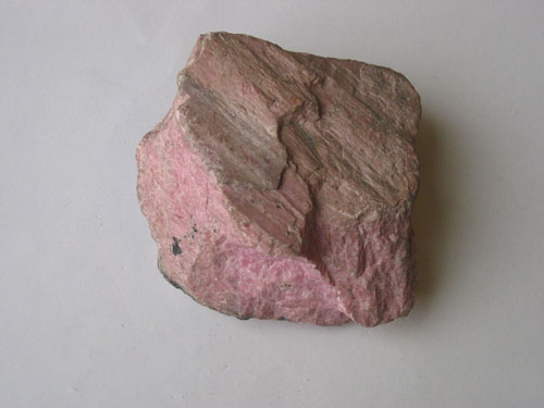 Rhodonite showing cleavage surface. 