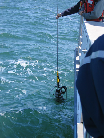 A sensor lowered into the water.