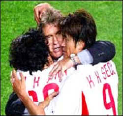 S. Korea's first victory celebrated by Guus Hiddink, the national team coach.