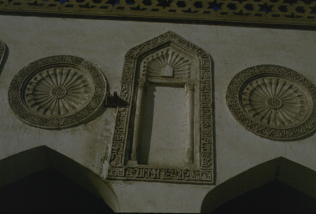 Decorative niches and roundels on the wall of the mosque porticos.