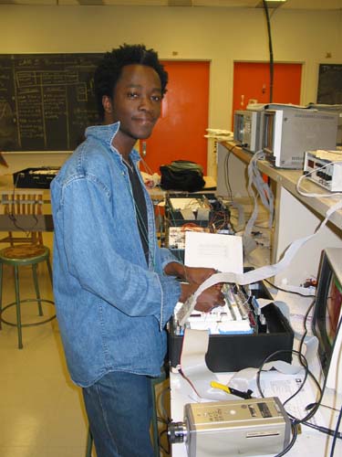 Student working on his group's Play Paratrooper and Lose Weight project.