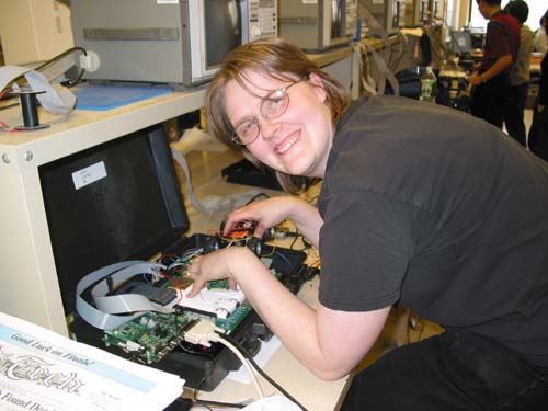 Student testing her group's Wireless Rover with External Video Feedback Control project.