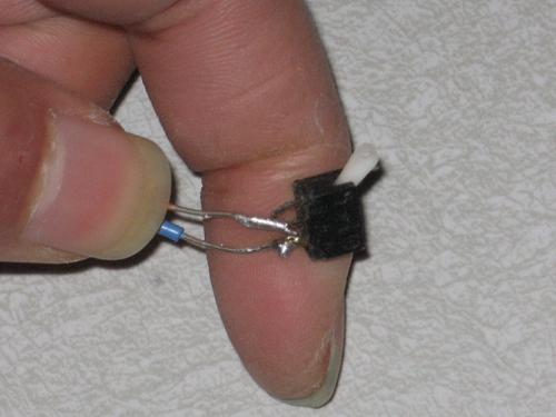 A black box, <1 cm long, with a protruding switch ~5 mm long.
