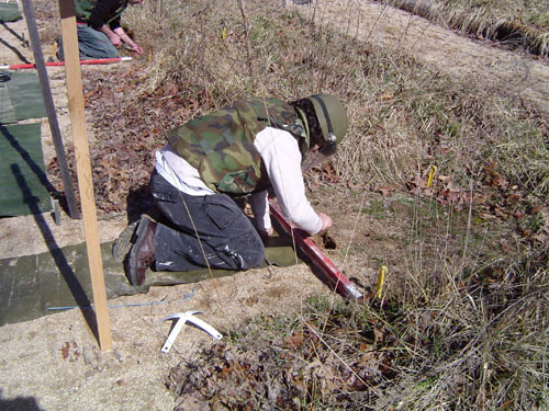 Student excavating.