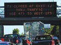 Photograph of heavy traffic on a highway.