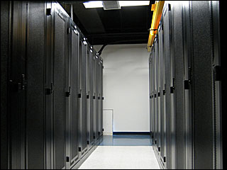 Photograph taken inside One Wilshire of the cabinets used to hold networking equipment.