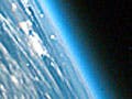  Oblique shot of the Earth from space featuring its curvature and atmosphere.