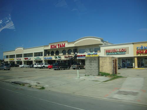 A strip mall with Vietnamese shops and restaurants.