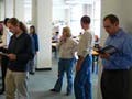 Library patrons standing before a desk.