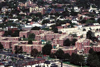 An aerial photo of many large brick apartment buildings.
