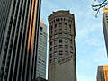 Photograph of tall buildings. Session 19 includes an example of investment in office/resource and development space.