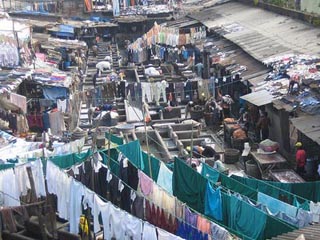 Photo showing a crowded area with laundry hanging throughout.