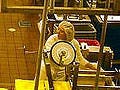 Factory workers at a cheese factory in Oregon form assembly lines around multiple conveyor belts.