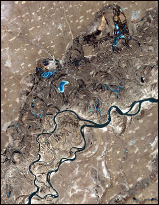A satellite photograph of a meandering river.
