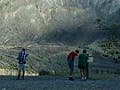 Students examining the aftermath of a landslide