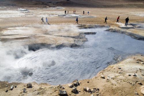 Students hiking by geothermal springs.