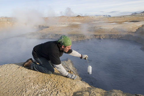 Sampling water from a geothermal spring.