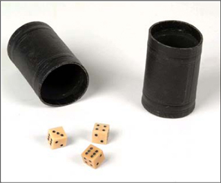 A photograph of three dice and two dice cups.