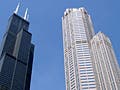 Photo of two skyscrapers against a blue sky.