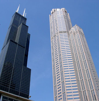Photo of two skyscrapers against a blue sky.
