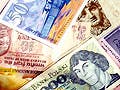 A collage of currency from countries around the world.