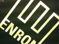 On the left is an image of Plato and Aristotle, on the right is the Enron logo.