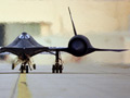 A stealth jet speeding down the runway.