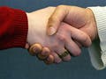 Two people shaking hands.