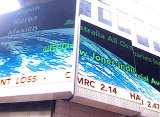 Phot of a billboard displaying a stock ticker.