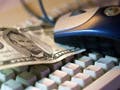 A keyboard, mouse, and five dollar bill.