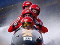 Bobsled team competing in Winter Olympics.