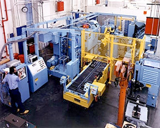 Several large machines in a manufacturing plant.
