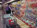 A photograph of a woman shopping in a Giant Supermarket.