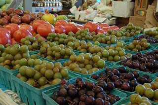 A photograph of produce at a farmers market.