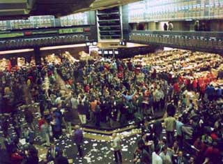 Photograph of a busy trading floor.