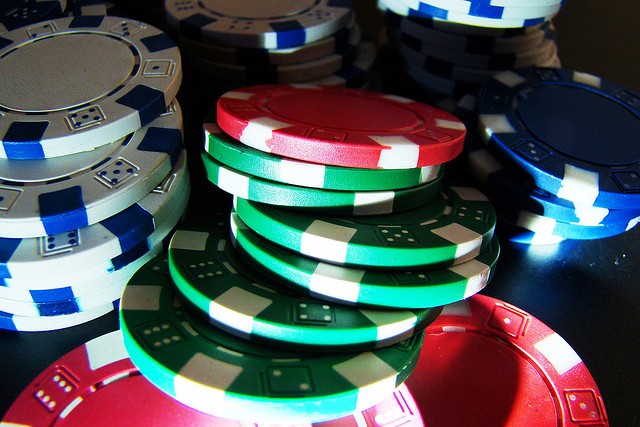 Close-up image of various colored poker chips.
