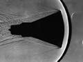 Mercury space capsule model with visible shockwaves and wake.