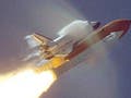 The shuttle passes Mach 1, producing shockwaves.