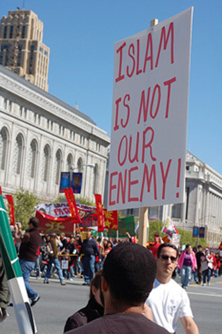 Protestor holding a sign - Islam is not our enemy!