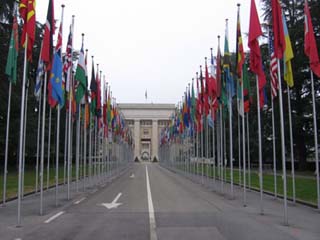 A photograph of the flag lined street that leads to the UN headquarters in Geneva, Switzerland.