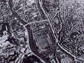 Two aerial photographs of Nagasaki, Japan. One shows the city with buildings and roads, and the latter shows the city completely wiped out.