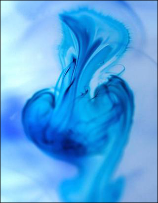 Image of a blue substance diffusing through a clear liquid.