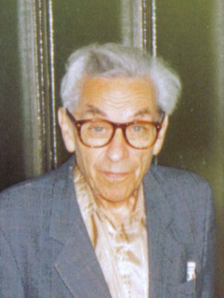 Photo of a man wearing glasses.