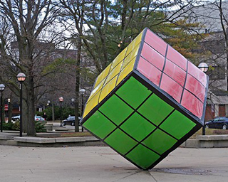 A big Rubik's cube on the street.