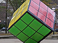 A big Rubik's cube on the street.