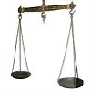 Photo of old-fashioned balance scales on a white background.