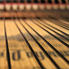 Close up image of piano strings inside a piano.