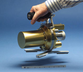 Photo of a metal, hand-held radiation detector.